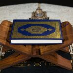 blue and white book on brown wooden table